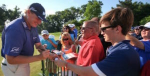 Ernie Els signs autographs after the third round of the Quicken Loans National at the Congressional Country Club in Bethesda, Maryland. (Photo by Bill Workinger / Voice of America)